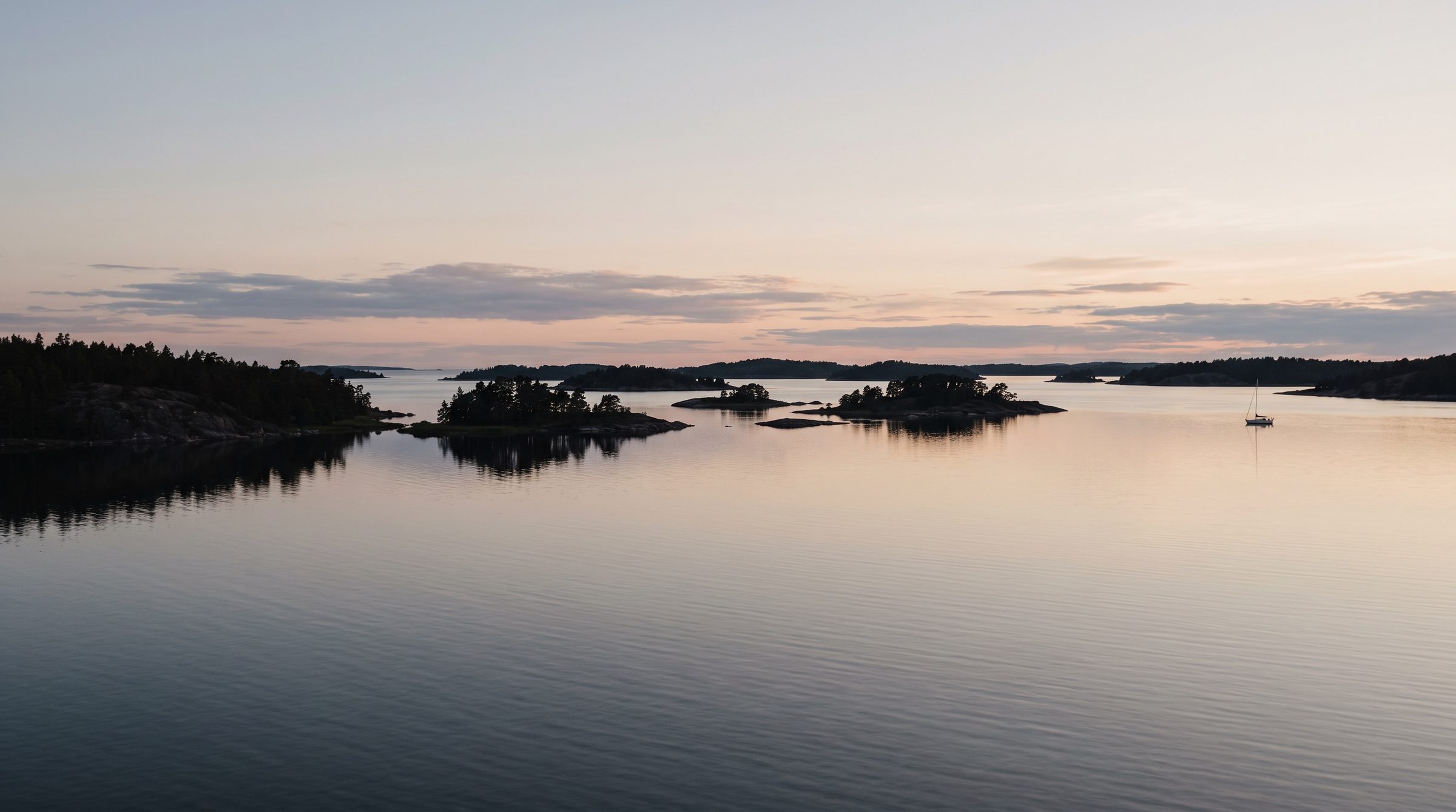 The archipelago at dusk, low islands on still water